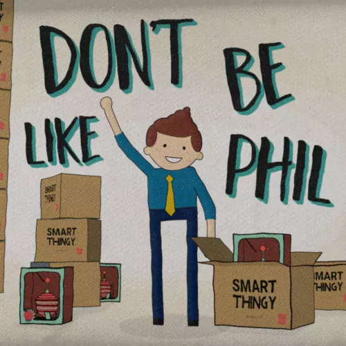 Phil waves at the viewer in front of piles of boxes of a weird product he sells.